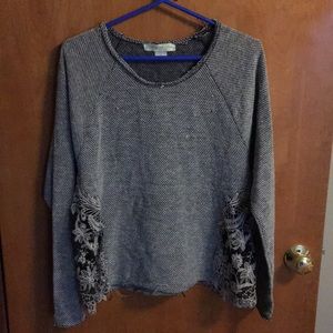 Gray sweater with mesh lace cut outs on the sides